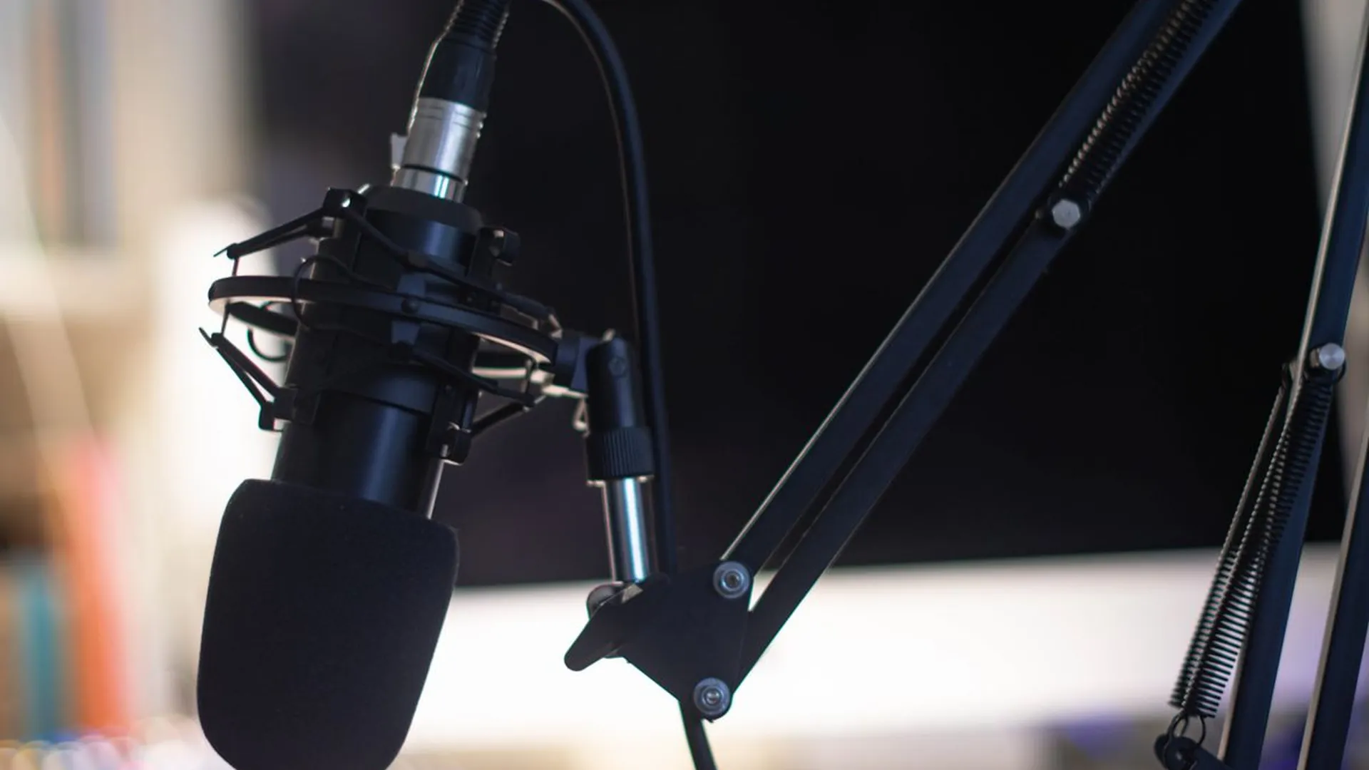 Professional microphone in a studio for podcast and voice recording