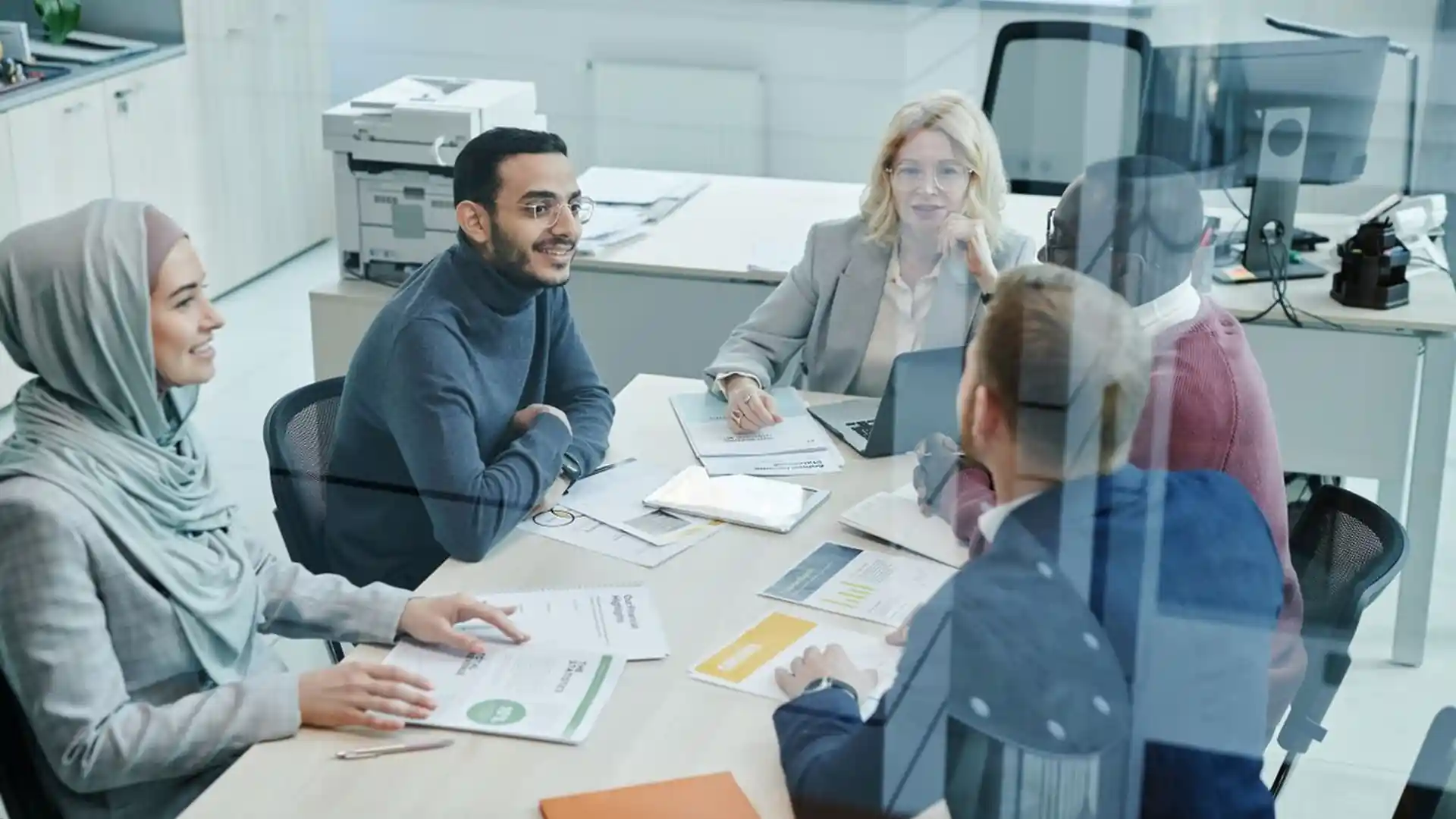 Business team collaborating around a table in a modern office