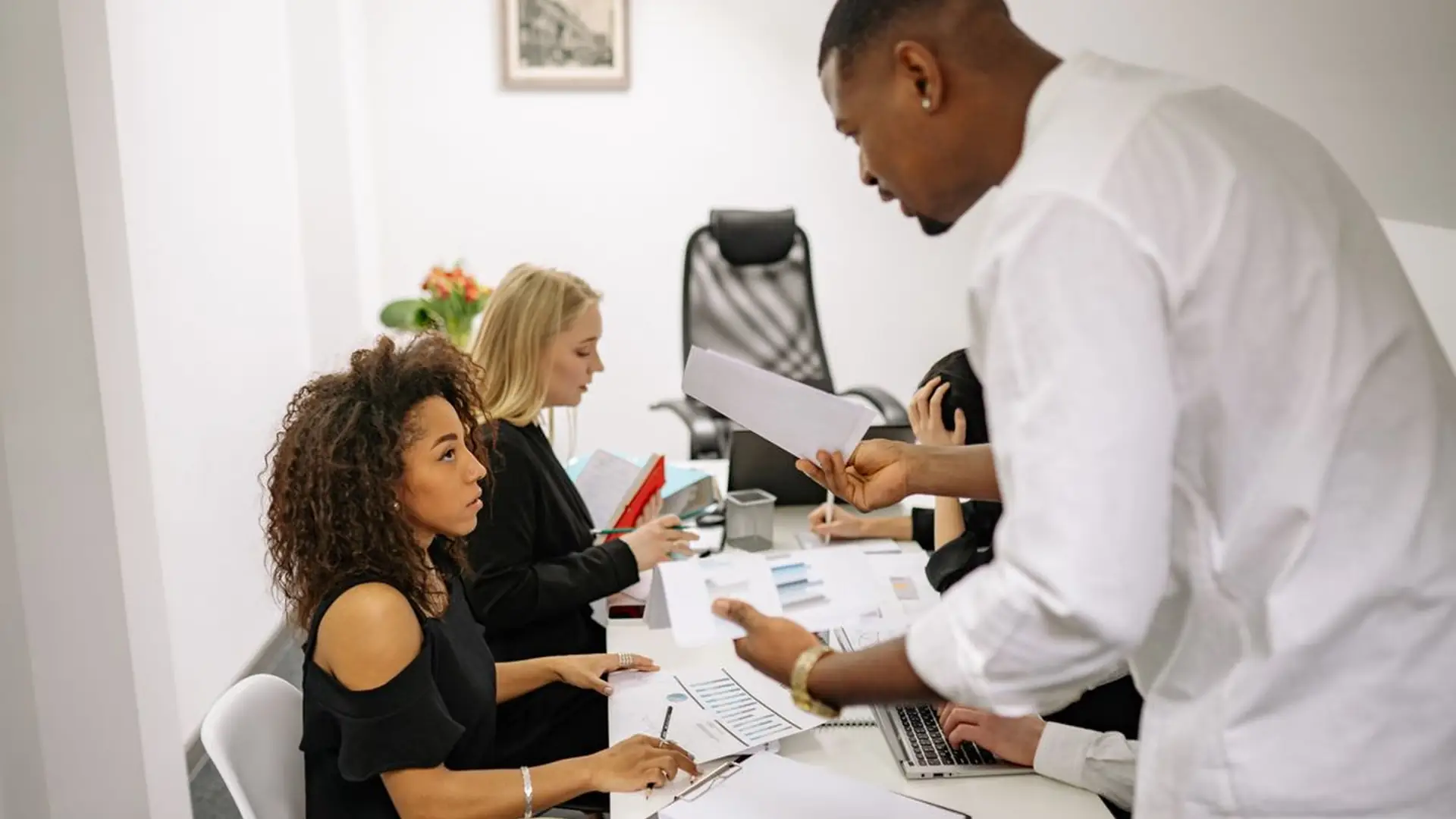 Business team collaborating around a table in a modern office
