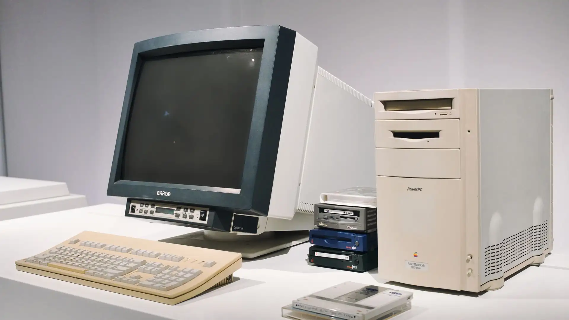 who created artificial intelligence — vintage CRT monitor, beige keyboard and tower PC from the early computing era on display
