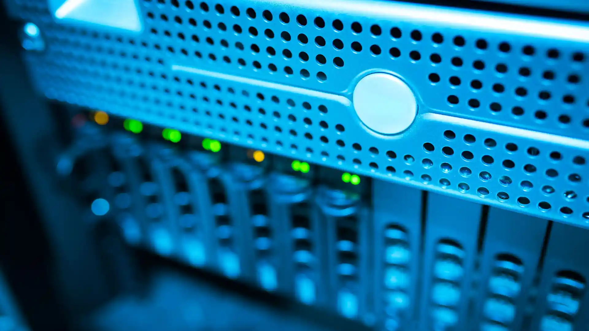 anthropic claude india launch — a close-up of a blue-lit data server rack with blinking indicator lights.