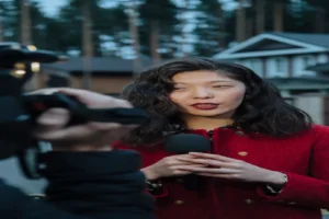 AI interview transcription software — real photo of a woman in a red coat being interviewed outdoors, holding a microphone while a camera films her