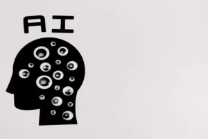 Mistral Large 4 model explained — real photo of a black-and-white paper-cut artwork showing a head silhouette filled with eyeballs under the word AI