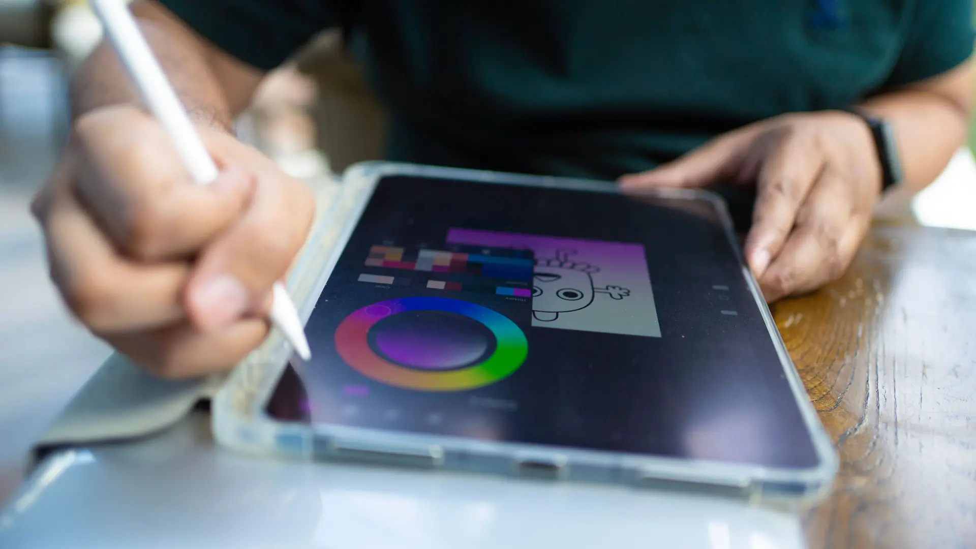 flux 3 image klein — a hand holding a stylus over a tablet showing a drawing app color wheel
