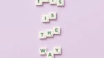 nyt connections purple category tips — Scrabble letter tiles spelling the phrase This is the way on a pastel purple background, seen from above.