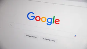 How AI search is changing Google rankings — real photo of the Google search homepage on a screen