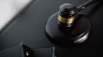 AI regulation update — real photo of a judge's gavel resting on a sound block