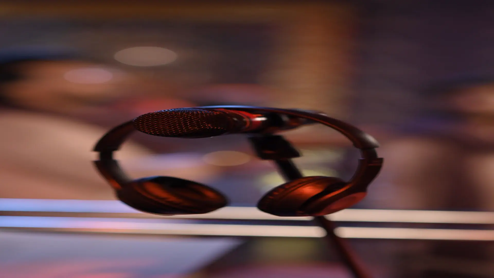 Best AI voice changer tools — real photo of headphones resting on a stand