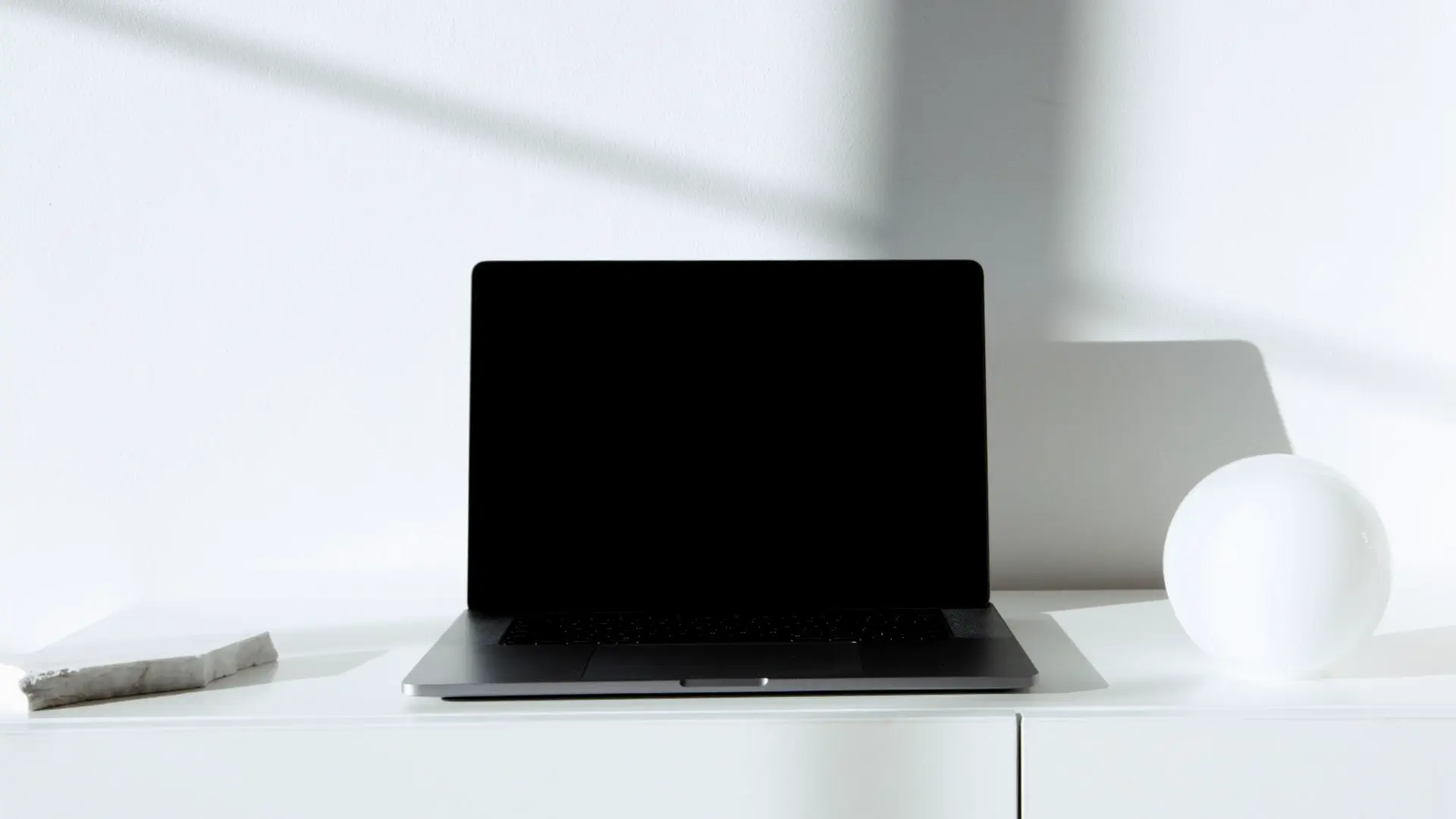 AI tools for affiliate marketing — real photo of a laptop on a bright minimal white desk